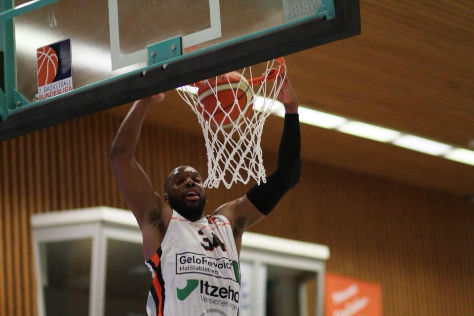 Coach Kaimyn dunking during professional game in Europe