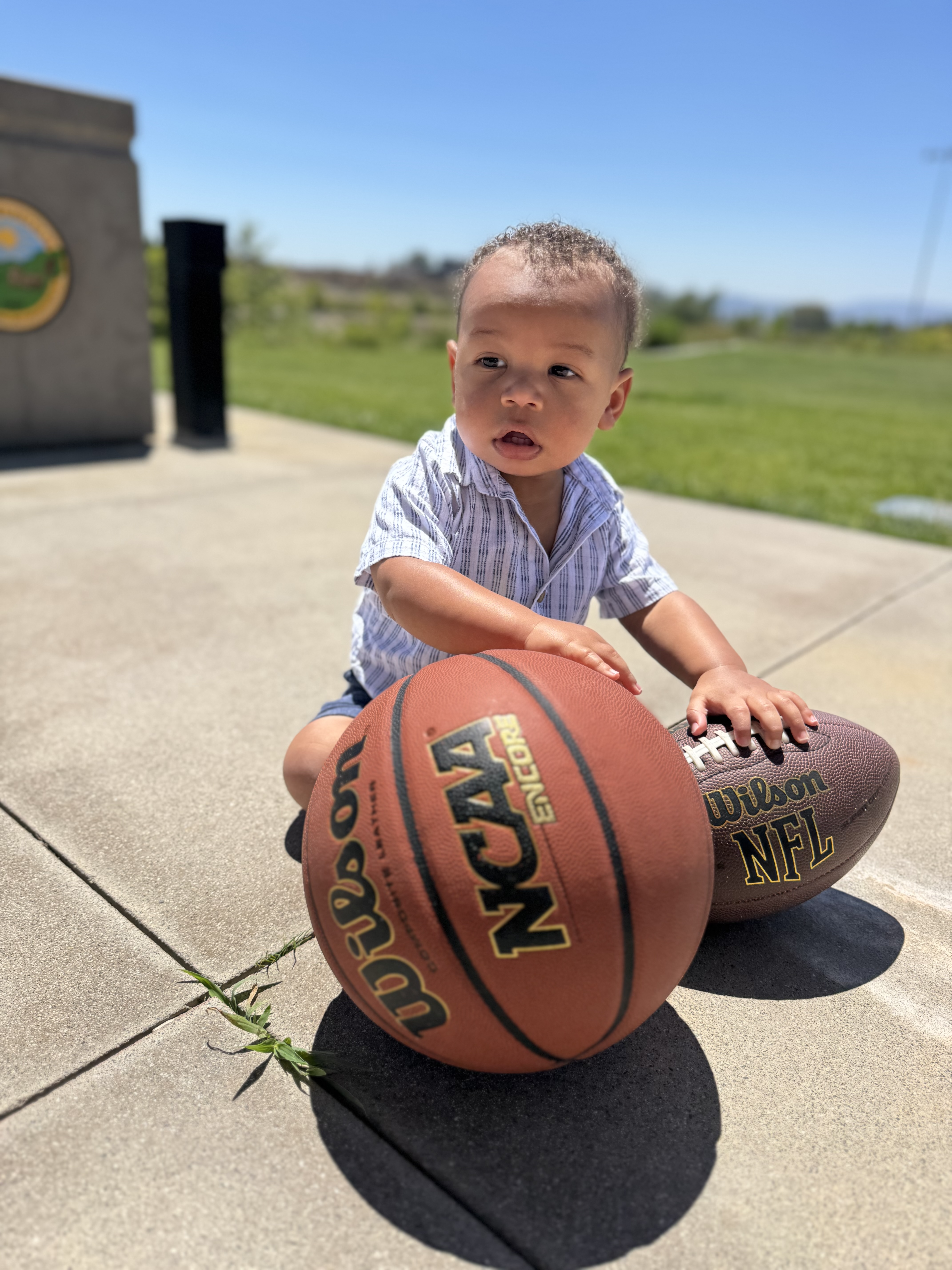 Coach Kaimyn's son with a basketball — the next generation
